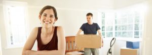Couple unpacking boxes